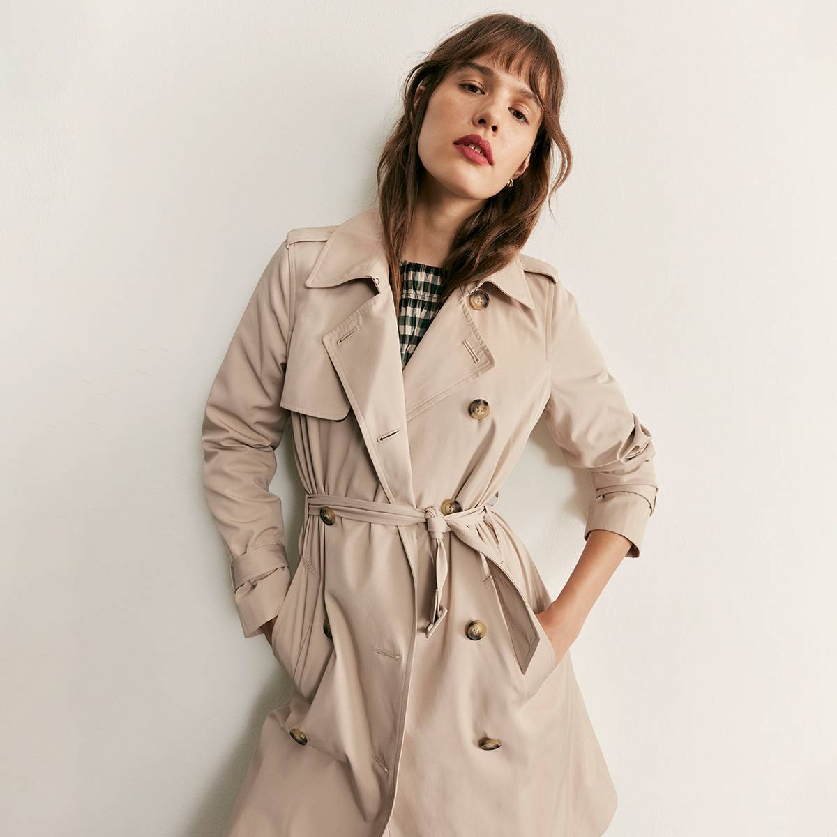  Woman wearing beige trench coat